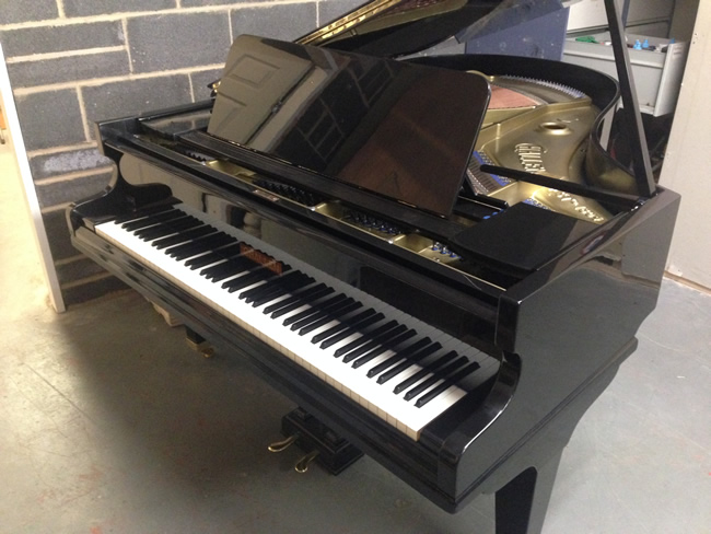 Challen 6ft grand piano repolished in a Black high gloss cabinet.